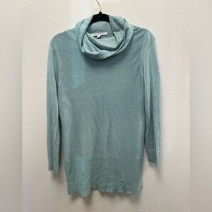 Gently used long turtleneck sweater. Blue/green in color.